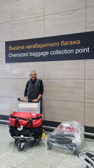 Jim at baggage claim Russia